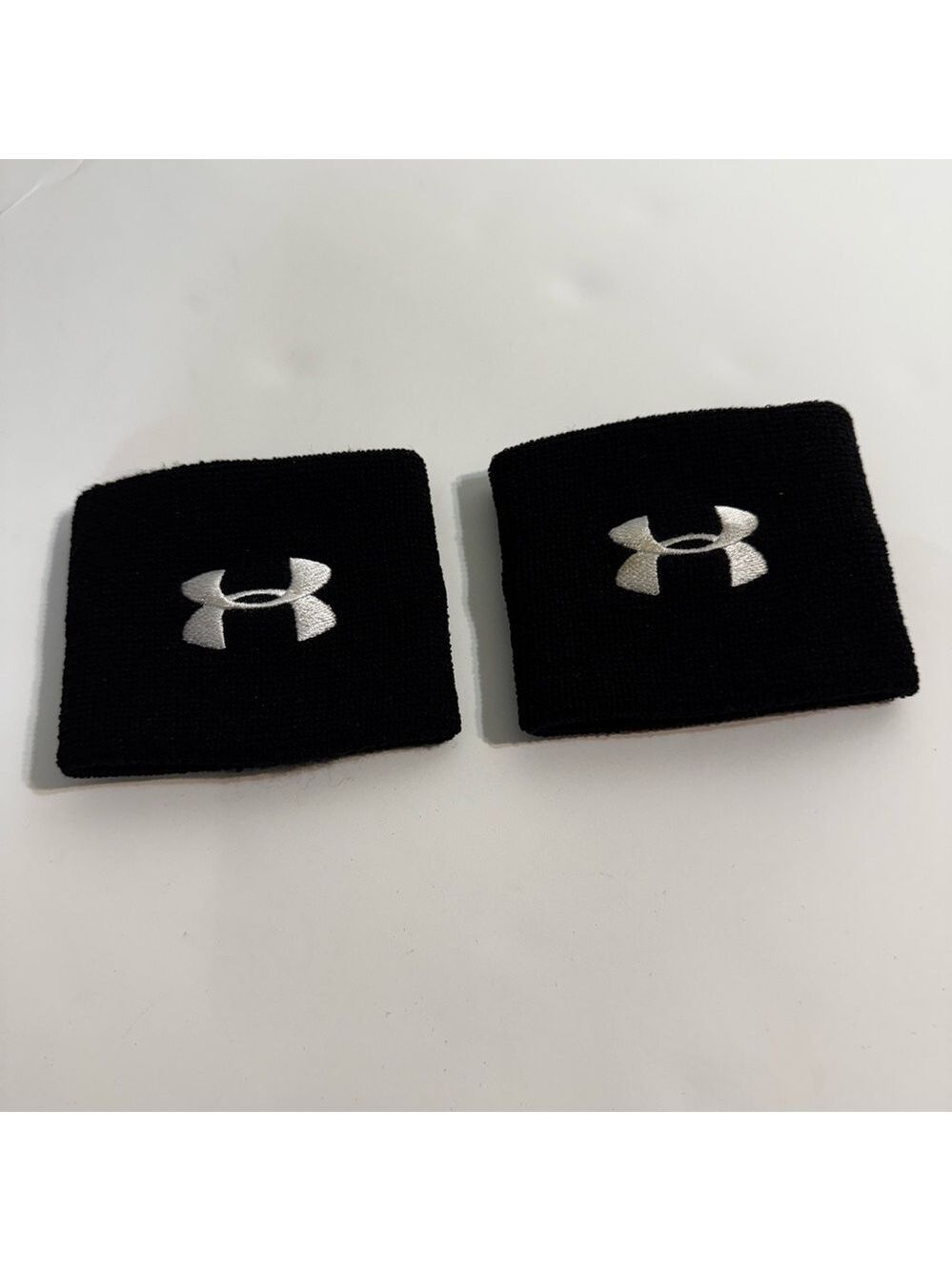 NWOT Under Armour Black Wristbands with White Embroidered Logo